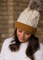 IVORY CABLE KNIT HAT WITH CAMEL CUFF AND FUR POM